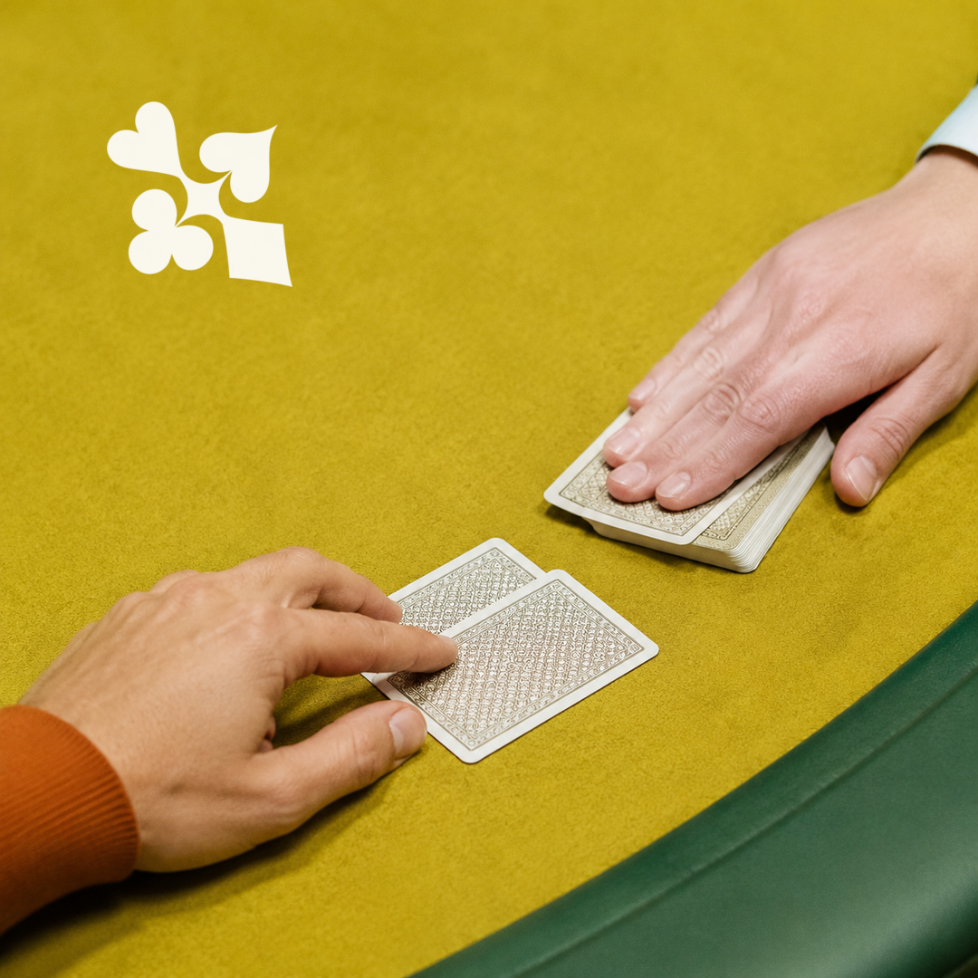 Player pushing folded cards towards the poker dealer