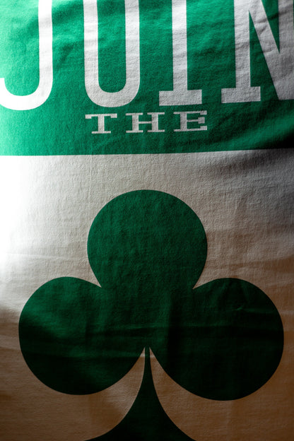 Portrait orientation detail of the green JOIN THE CLUB WHITE HOT poker T-shirt artwork