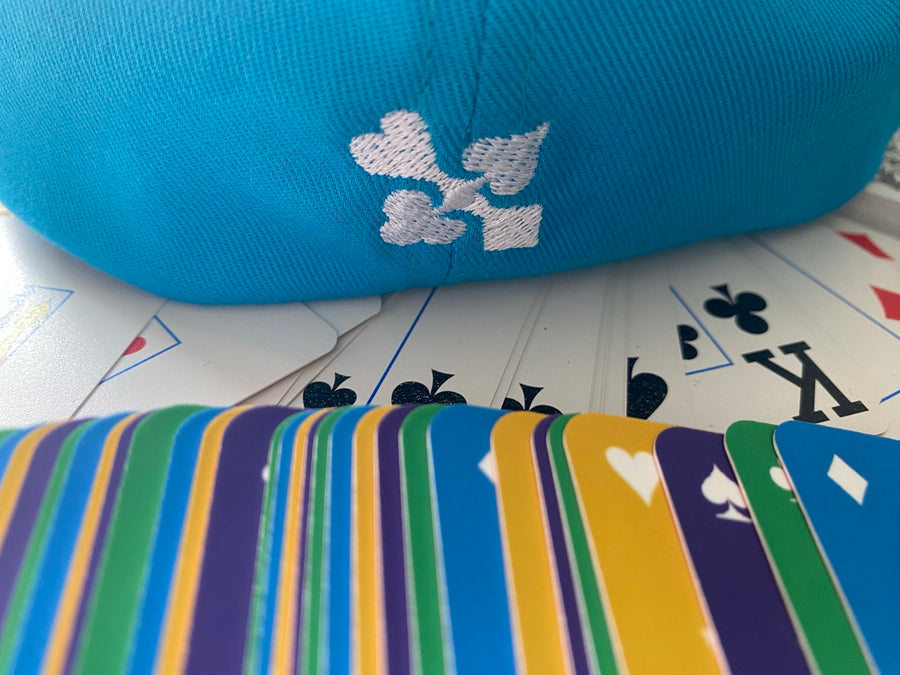 WHITE HOT POKER blue cap with four-suit embroidery and colourful branded poker cards